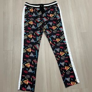 80s 90s Track Pants with Zipper Bottoms and Geometric Print.
